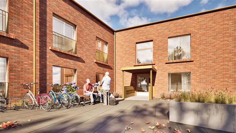 Havainnekuva Vartiokylään rakentuvasta hoivakodista. Punaruskea, tiilivuorattu kaksikerroksinen rakennus.